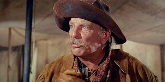 Denver Pyle as Alfie, who declares the presence and girls and drink reason enough to keep a stage rolling through in Welcome to Hard Times (1967)