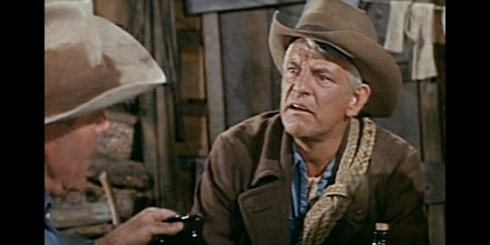 Denver Pyle as Bull, friend of Ben and Howdy's, stopping by their line shack for a visit in The Rounders (1965)
