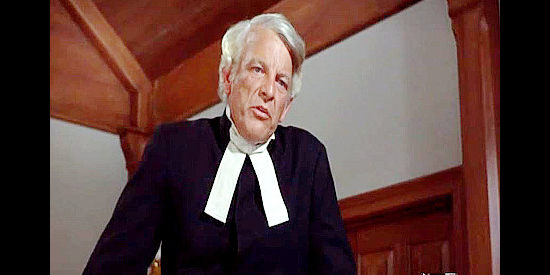 Denver Pyle as Pastor Bjoerling, scolding Charlie Anderson for allowing his family to be disruptive during service in Shenandoah (1965)