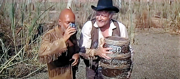 Donald Pleasance as Oracle Jones and Brian Keith as Frank Wallingham celebrate a recovered barrel of whiskey in The Hallelujah Trail (1965)