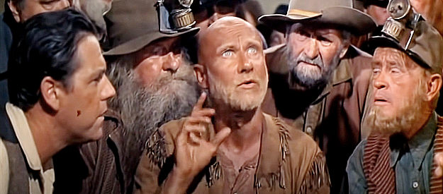 Donald Pleasance as Oracle Jones, predicting a long, dry winter if Denver can't get more booze before the first snow in The Hallelujah Trail (1965)