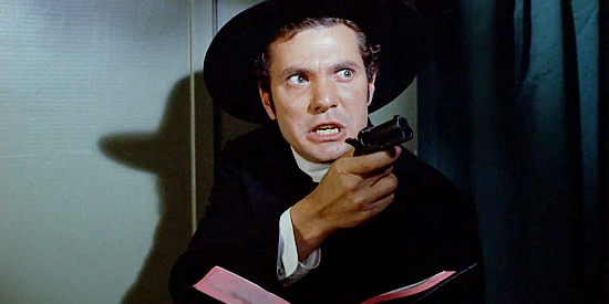 Dwayne Hickman as Jed, pretending to be a preacher, but equipped with a pistol in his Bible in Cat Ballou (1965)