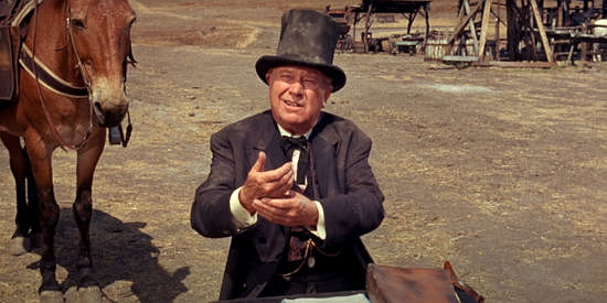 Edgar Buchanan as Mr. Brown, arriving to make sure the town is nice and legal in Welcome to Hard Times (1967)