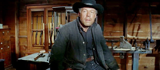 George Kennedy as Curley, the fast gun Morgan Hastings hires to deal with the Elders in The Sons of Katie Elder (1965)