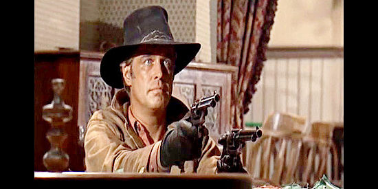 George Peppard as Dolan, dispensing justice with a pair of six-guns in Rough Night in Jericho (1967)