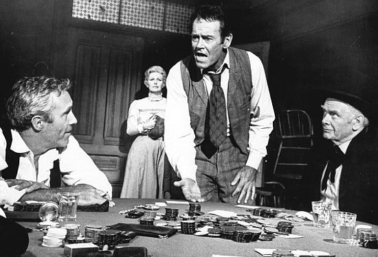 Henry Fonda as Meredith tries to make a point in his poker game with Henry Drummond (Jason Robards, right) and Benson Tropp (Jason Robards) while his wife Mary (Joanne Woodward) looks on in A Big Hand for the Little Lady (1966)