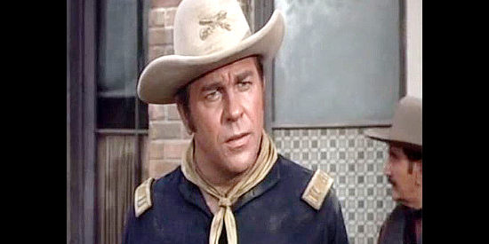 Howard Keel as Capt. Tom York, arriving in Deadwood in hopes of preventing another Indian massacre in Red Tomahawk (1967)