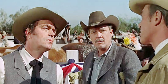 Jack Elam as Deke Simons and Sam Burnett argue while old-timer Jeff Harter (Ben Johnson) looks on in The Rare Breed (1966)