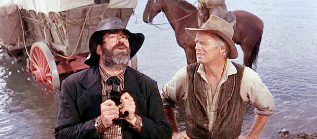 Jack Elam as Preacheer Weatherby, discovered hiding under a wagon by Lije Evans (Richard Widmark) in The Way West (1967)