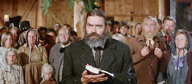 Jack Elam as Preacher Weatherby, performing a marriage service and shocked by something he hears in The Way West (1967)