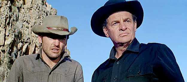 James Gregory (right) as Morgan Hastings, the man behind the trouble, flanked by son Dave (Dennis Hopper) in The Sons of Katie Elder (1965)