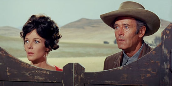 Janice Rule as Molly Riordan and Henry Fonda as Will Blue, about to confront a madman in Welcome to Hard Times (1967)