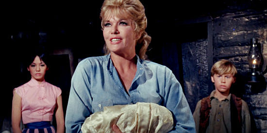 Janis Paige as Adah, Zar's woman, making a peace offering to Molly in Welcome to Hard Times (1967)