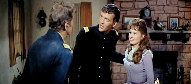 Jim Hutton as Capt. Paul Slater and Pamela Tiffin as Louise Gearhart try to explain themselves to Col. Gearhart in The Hallelujah Trail (1965)