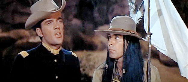 Jim Hutton as Capt. Paul Slater, relaying the Indians' demands as Chief Walks Stooped Over (Martin Landau) looks on in The Hallelujah Trail (1965)