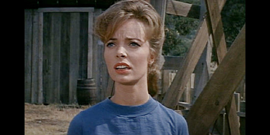 Joan Freeman as Meg Moore, the pretty young lass who would like to get Ben Jones to settle down in The Rounders (1965)