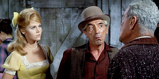 John Marley as Frank Ballou, confronting the sheriff about a poisoned well while Cat looks on in Cat Ballou (1965)