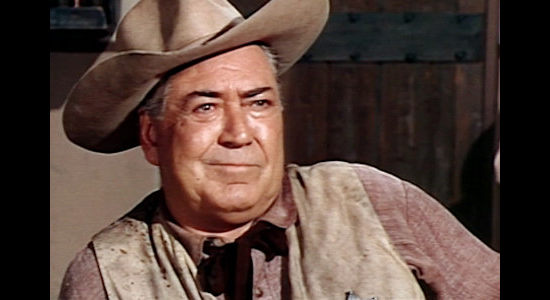 Johnny Mack Brown as Sheriff Green, learning that the notorious Willie Duggans has landed in his town in The Bounty Killer (1965)