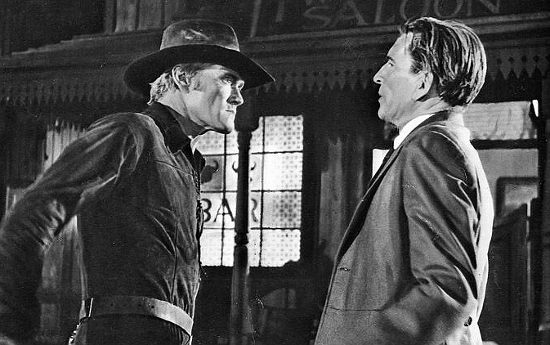 Jonas Trapp (Chuck Connors) confronts Brooks Durhan (Michael Rennie) in Ride Beyond Vengeance (1966)