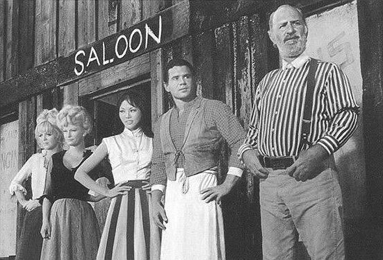 Keenan Wynn as saloon owner Zar (right) with Blossom (Kalen Luie), Bert Albany (Dan Ferrone) and two of Zar's other girls in Welcome for Hard Times (1967)