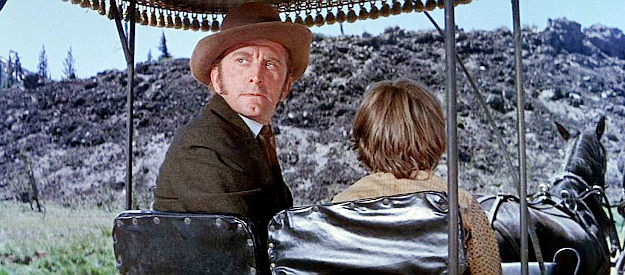 Kirk Douglas as William Tadlock, glancing back at the body of a wagon train passenger he just hanged in The Way West (1967)