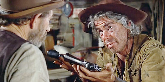 Lee Marvin as Kid Shelleen, offering to sell his pistol so he can afford more whiskey in Cat Ballou (1965)