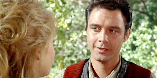 Michael Callan as Clay Boone, suddenly wary when Cat Ballou starts talking about love in Cat Ballou (1965)