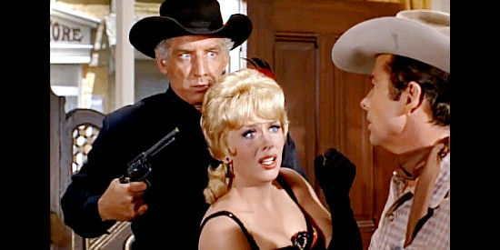 Morgan Woodward as Drago kidnaps Uvalde (Joan Staley) as Chad Lucas (Audie Murphy) looks on in Gunpoint (1966)