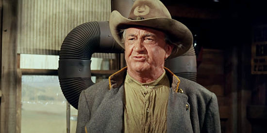 Paul Fix as Major Munn, wishing he was young enough to take on the blood-thirsty stranger in Welcome to Hard Times (1967)