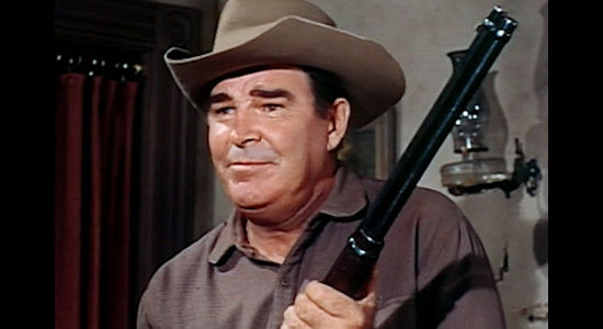 Rob Cameron as Johnny Liam, the man who warns Willie Duggans that he'll need a gun to survive in the West in The Bounty Killer (1965)