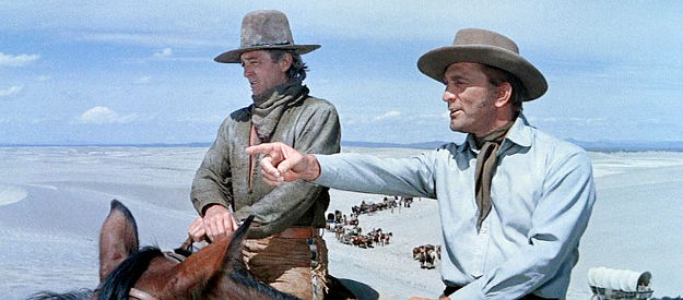 Robert Mitchum as Dick Summers and Kirk Douglas as William Tadlock guide the wagon train through the desert in The Way West (1967)