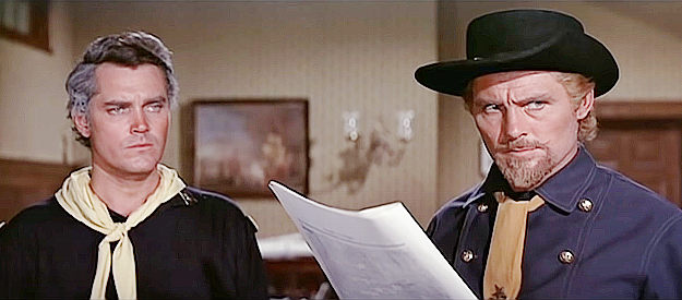 Robert Shaw as George Custer, reviewing plans for the upcoming Indian campaign with Capt. Benteen (Jeffrey Hunter) in Custer of the West (1967)