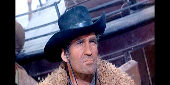Rod Taylor as Chuka, watching an Arapaho warband approach a broken down stagecoach in Chuka (1967)