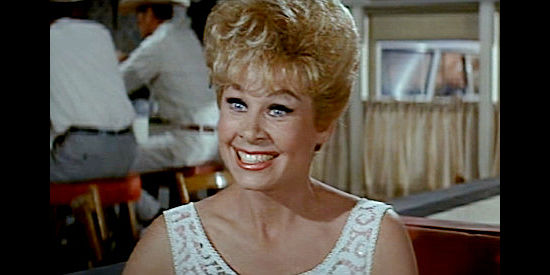 Sue Ann Langdon as Mary, the bubbly stripper Ben and Howdy rescue when her car breaks down in The Rounders (1965)