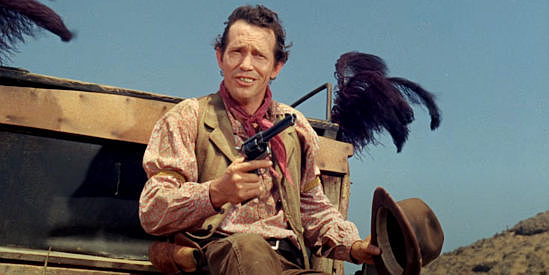 Warren Oates as Leo Jenks, ready to show off his shooting skill from atop a hearse in Welcome to Hard Times (1967)