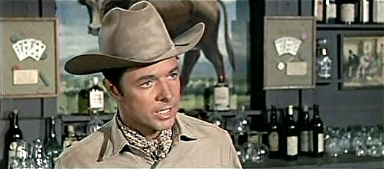 Audie Murphy as Clint Cooper tries to talk sense into the vengeance seeking Morrison family in The Quick Gun (1964)