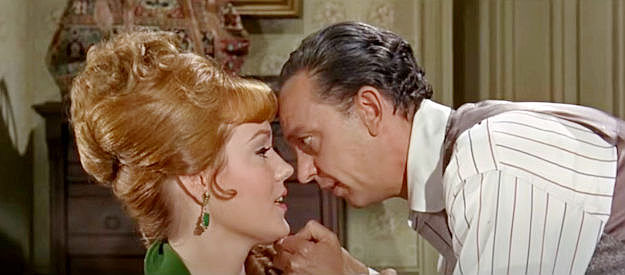 Barbara Rhoades as Penelope Cushings and Don Knotts as Dr. Jesse Heywood getting closer in The Shakiest Gun in the West (1968)