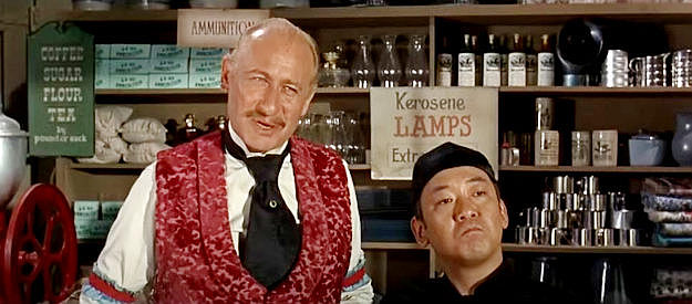 Carl Ballantine as Abel Swanson and Pat Morita as Wong, working together to swindle Dr. Jesse Heywood in The Shakiest Gun in the West (1968)