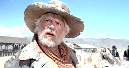 Denver Pyle as Junior Frisbee has a score to settle with Baker in Something Big (1971)