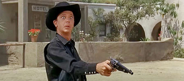 Don Knott as Dr. Jesse Heywood, practicing his aim in preparation for a showdown in The Shakiest Gun in the West (1968)