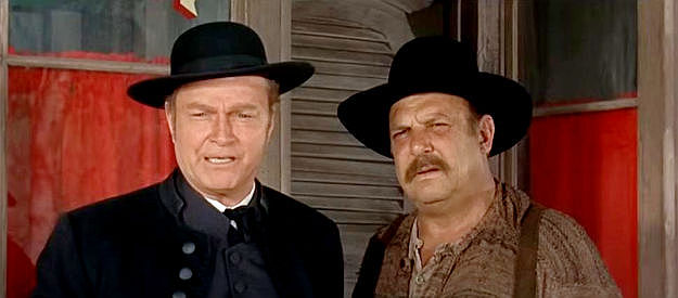 Don 'Red' Barry as Zachary Gant and Jackie Coogan as Matthew Basch, gunrunners posing as a reverend and his assistant in The Shakiest Gun in the West (1969)