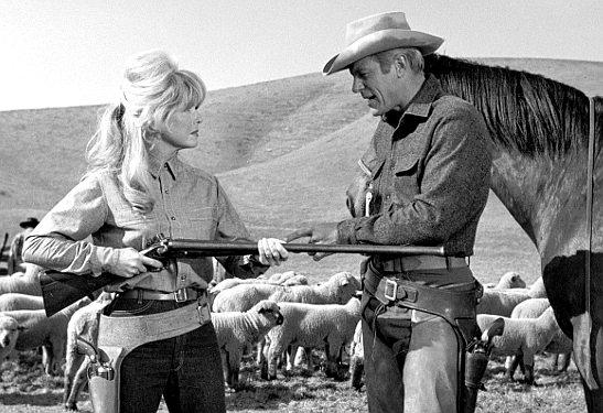 Doris Day as Josie Minick prepares to protect her sheep herd as Jason Meredith (Peter Graves) plays peacekeeper in The Ballad of Josie (1967)