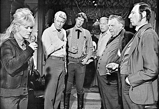 Doris Day as Josie Minick tries a man's drink while Jason Meredith (Peter Graves), Sheriff Pruitt (David Hartman), Arch Ogden (George Kennedy), and Judge Tatum (Andy Devine) look on in The Ballad of Josie (1967)