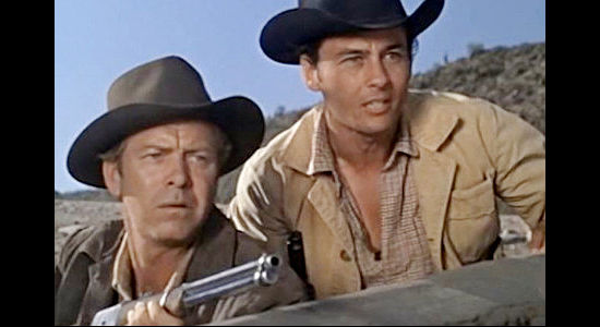 Gene Nelson as Gil Shepard and Jerry Summers as Martin Beaumont, trying to fend off an Apache attack in The Purple Hills (1961)