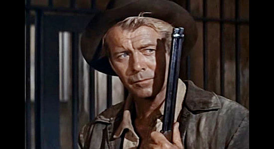Gene Nelson as Gil Shepard, realizing someone else is trying to claim the bounty that should be his in The Purple Hills (1961)