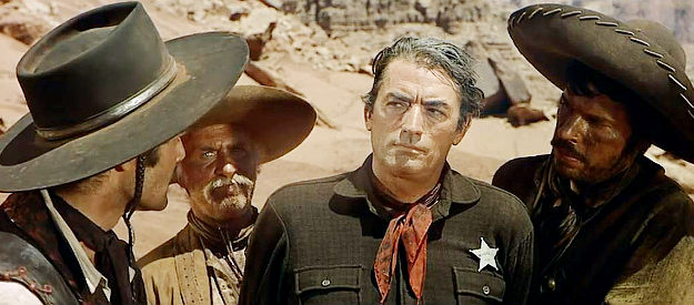 Gregory Peck as MacKenna, falling into the hands of Colorado and his men, even minus a treasure map, in MacKenna's Gold (1969)