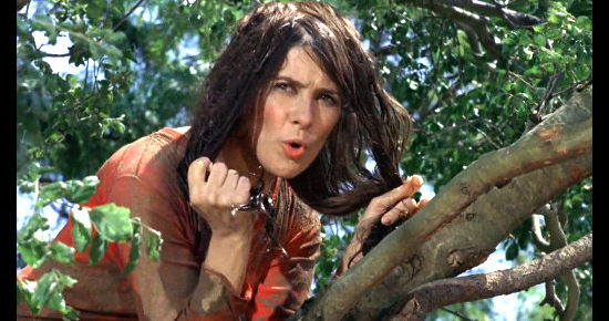 Joan Hackett as Prudy Perkins, annoyed at having been caught in a tree in Support Your Local Sheriff (1969)