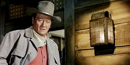 John Wayne as Cole Thornton, riding to the assistance of an old friend in El Dorado (1967)