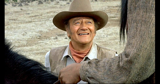 John Wayne as John Henry Thomas in The Undefeated (1969)