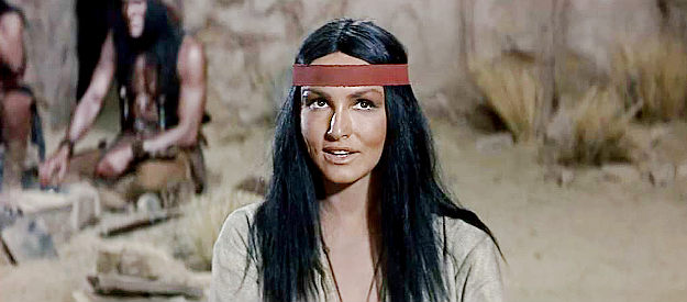 Julie Newmar as Hesh-Ke, realizing an old flame named MacKenna will be joining the search for gold in MacKenna's Gold (1969)
